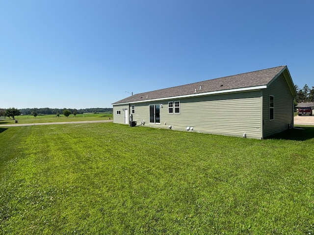 675 Brooks St S, Eden Valley, MN 55329 - rear view of house with a lawn