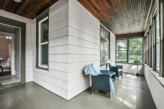 3339 Aldrich Ave N, Minneapolis, MN 55412 - sunroom / solarium featuring finished concrete floors, wood ceiling, and wood walls