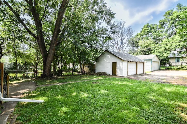 3339 Aldrich Ave N, Minneapolis, MN 55412 - view of yard featuring an outdoor structure and a detached garage