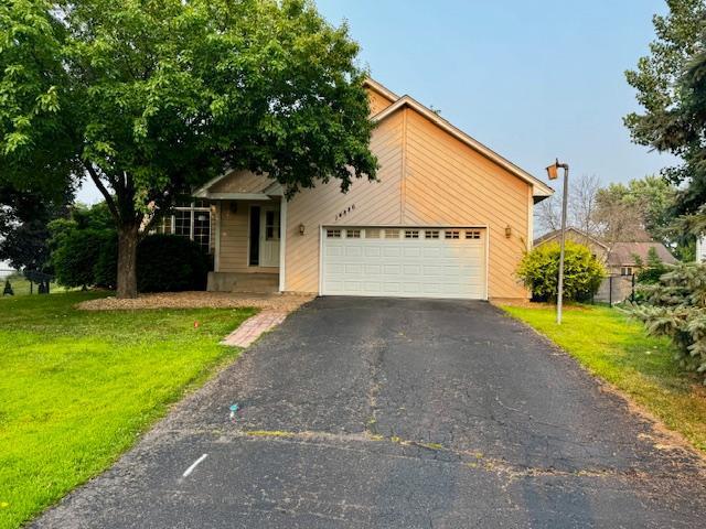 14886 Crandall Ave W, Rosemount, MN 55068 - view of front of house with driveway, a front lawn, and an attached garage