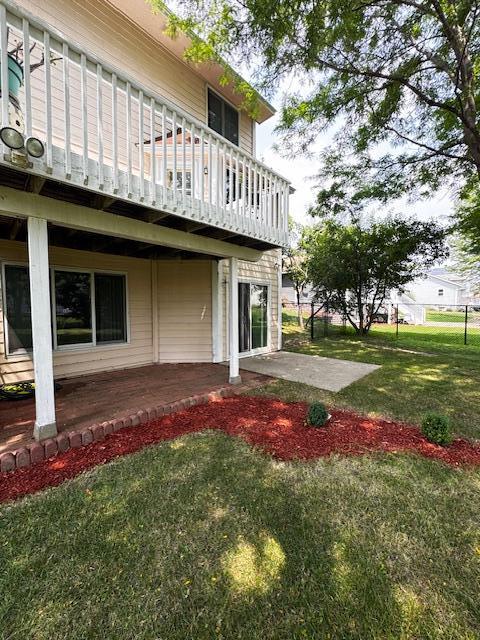 14886 Crandall Ave W, Rosemount, MN 55068 - view of home's exterior featuring a patio area and a lawn