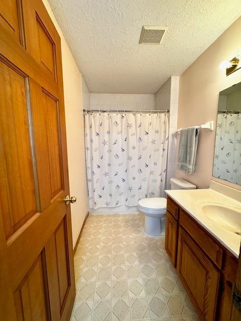 14886 Crandall Ave W, Rosemount, MN 55068 - full bath with a textured ceiling, vanity, and curtained shower