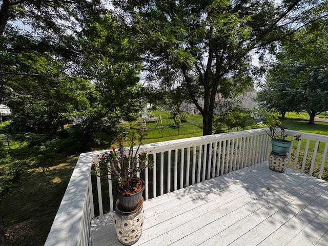 14886 Crandall Ave W, Rosemount, MN 55068 - wooden deck featuring a lawn