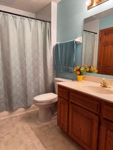 14886 Crandall Ave W, Rosemount, MN 55068 - bathroom with vanity, a textured ceiling, tile patterned floors, and a shower with curtain
