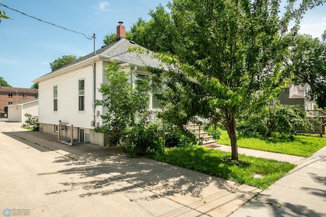 1137 11th St N, Fargo, ND 58102 - view of side of property with a chimney