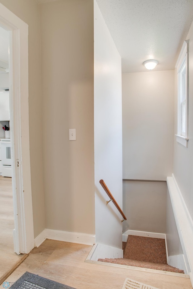 1137 11th St N, Fargo, ND 58102 - stairs featuring baseboards and wood finished floors