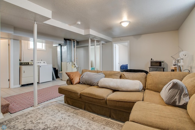 1137 11th St N, Fargo, ND 58102 - living area with washer and clothes dryer, light tile patterned flooring, a textured ceiling, and heating unit