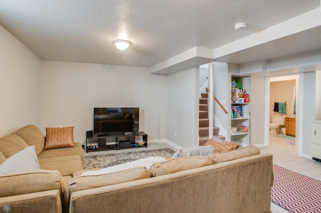 1137 11th St N, Fargo, ND 58102 - living room with a textured ceiling, stairway, and light tile patterned flooring