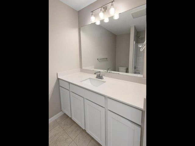 6711 Granby St, North Branch, MN 55056 - bathroom with vanity, tile patterned floors, and  shower combination