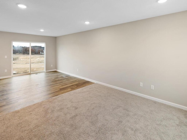 6711 Granby St, North Branch, MN 55056 - unfurnished room featuring recessed lighting, carpet floors, and wood finished floors