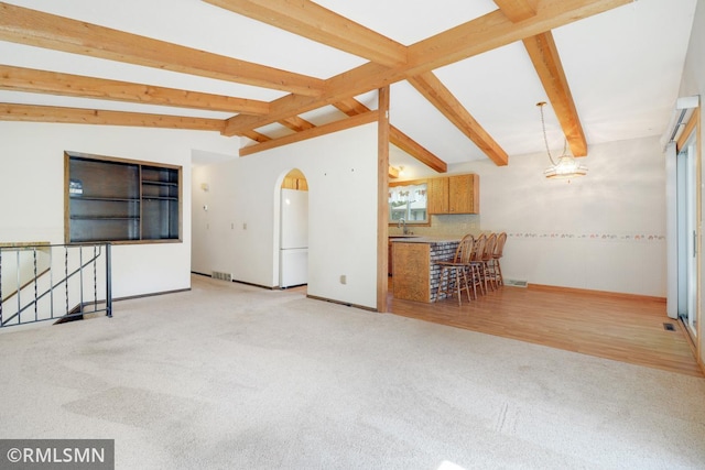 5733 Riverview Entry, Champlin, MN 55316 - carpeted spare room featuring arched walkways and a sink
