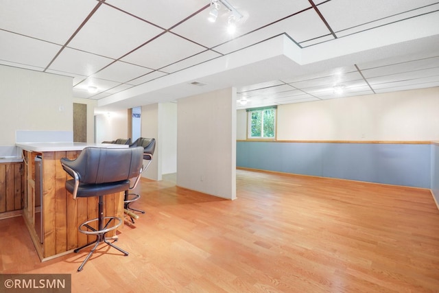 5733 Riverview Entry, Champlin, MN 55316 - indoor dry bar featuring light wood finished floors and a paneled ceiling