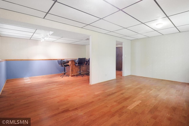 5733 Riverview Entry, Champlin, MN 55316 - below grade area with a drop ceiling and wood finished floors