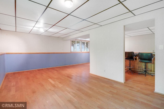 5733 Riverview Entry, Champlin, MN 55316 - empty room with wood finished floors and a paneled ceiling