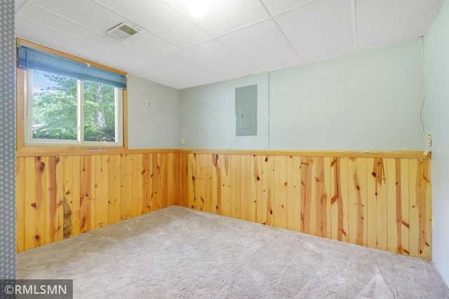 5733 Riverview Entry, Champlin, MN 55316 - carpeted empty room featuring electric panel, wood walls, and a wainscoted wall