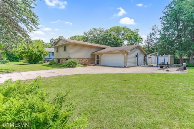 5733 Riverview Entry, Champlin, MN 55316 - view of front of home with concrete driveway, a storage unit, brick siding, and a garage