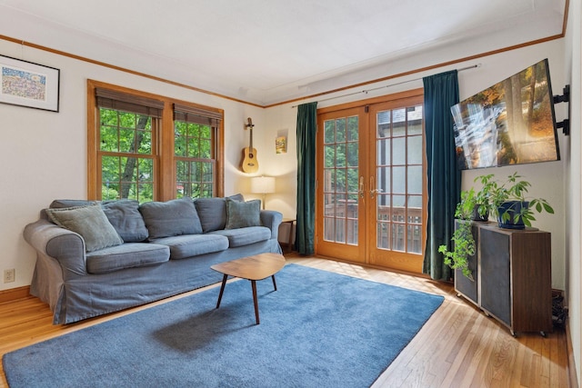 3607 Sheridan Ave N, Minneapolis, MN 55412 - living room featuring french doors, wood finished floors, and crown molding