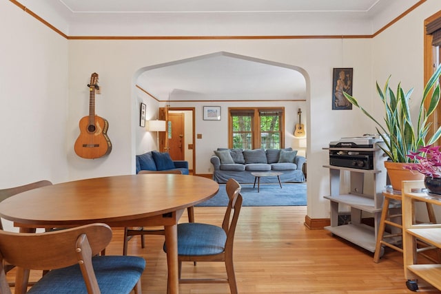 3607 Sheridan Ave N, Minneapolis, MN 55412 - dining area with arched walkways and light wood finished floors