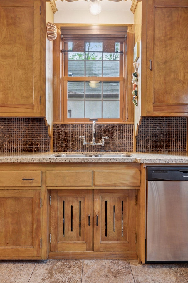 3607 Sheridan Ave N, Minneapolis, MN 55412 - kitchen with dishwasher, backsplash, and brown cabinets