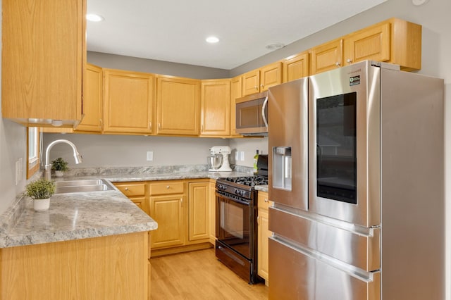 6700 168th St W, Lakeville, MN 55068 - kitchen with stainless steel appliances, light brown cabinetry, light countertops, light wood finished floors, and recessed lighting