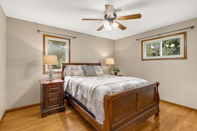 6700 168th St W, Lakeville, MN 55068 - bedroom featuring light wood finished floors and a ceiling fan