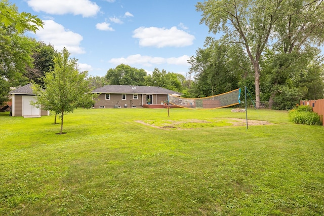 6700 168th St W, Lakeville, MN 55068 - view of grassy yard featuring volleyball court and a storage unit