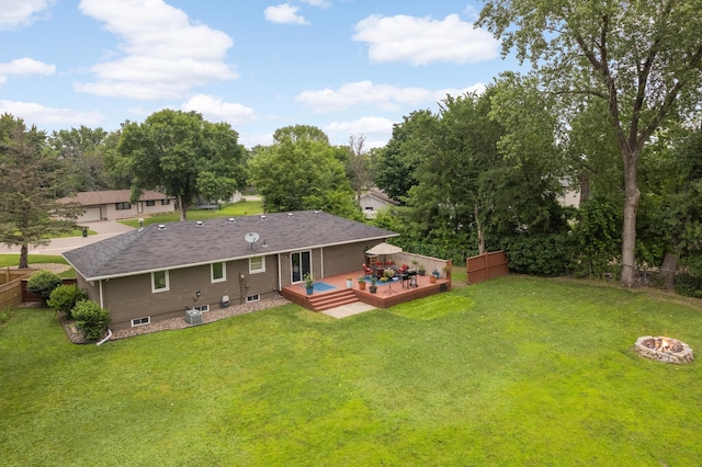 6700 168th St W, Lakeville, MN 55068 - rear view of property featuring a wooden deck, a fire pit, and view of scattered trees