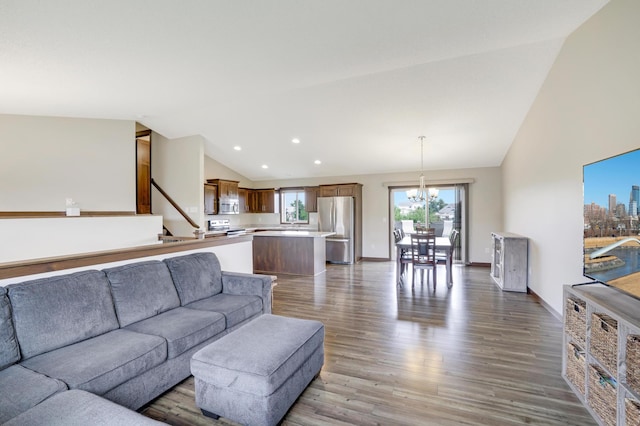1035 Emerald St NE, Hanover, MN 55341 - living room featuring a chandelier, wood finished floors, stairs, recessed lighting, and high vaulted ceiling