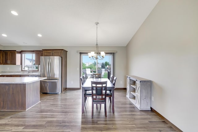 1035 Emerald St NE, Hanover, MN 55341 - dining area featuring a chandelier, recessed lighting, and light wood-style floors