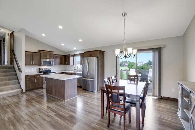 1035 Emerald St NE, Hanover, MN 55341 - kitchen with stainless steel appliances, a chandelier, light countertops, a center island, and dark wood-style flooring