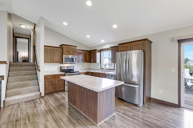 1035 Emerald St NE, Hanover, MN 55341 - kitchen with appliances with stainless steel finishes, plenty of natural light, light countertops, vaulted ceiling, and light wood finished floors