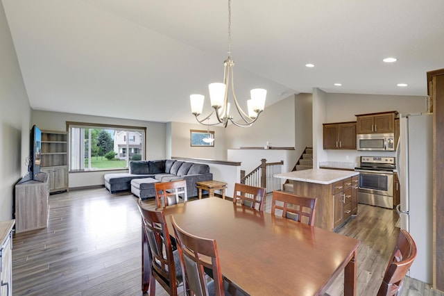 1035 Emerald St NE, Hanover, MN 55341 - dining space featuring lofted ceiling, dark wood-style floors, a chandelier, and recessed lighting