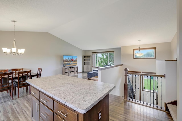 1035 Emerald St NE, Hanover, MN 55341 - kitchen featuring light wood-style floors, a chandelier, light countertops, and lofted ceiling