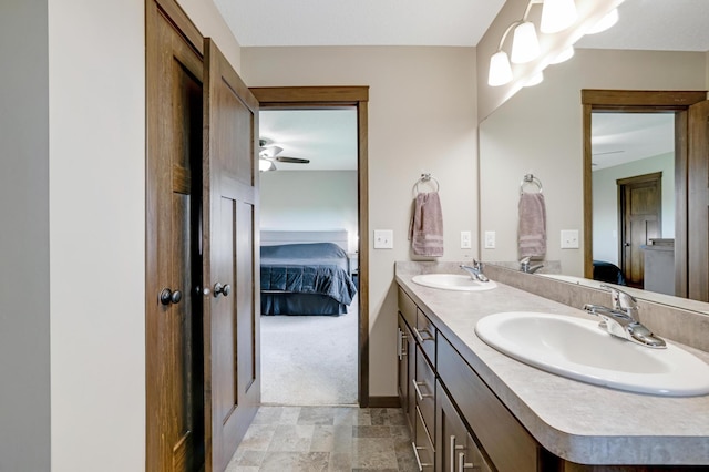 1035 Emerald St NE, Hanover, MN 55341 - ensuite bathroom featuring double vanity, ceiling fan, and stone finish floors