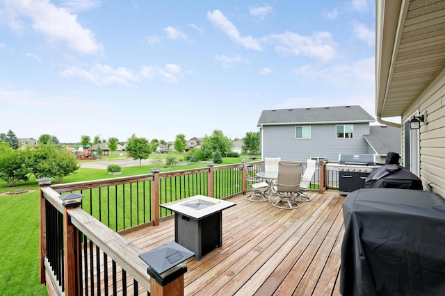 1035 Emerald St NE, Hanover, MN 55341 - wooden deck with outdoor dining space, a yard, a residential view, and area for grilling