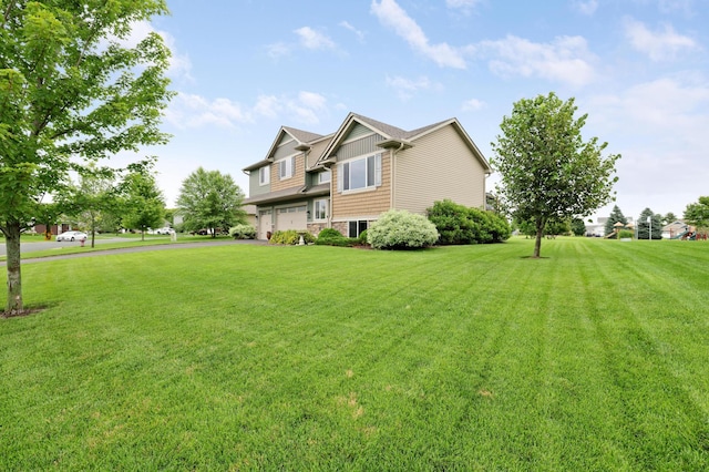 1035 Emerald St NE, Hanover, MN 55341 - view of grassy yard featuring a garage