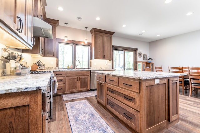7170 29th Ave SW, Pequot Lakes, MN 56472 - kitchen with stainless steel appliances, a center island, recessed lighting, dark wood-type flooring, and hanging light fixtures