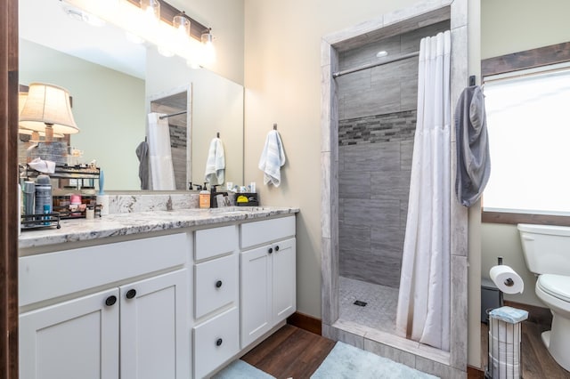 7170 29th Ave SW, Pequot Lakes, MN 56472 - full bathroom featuring vanity, wood finished floors, and a tile shower