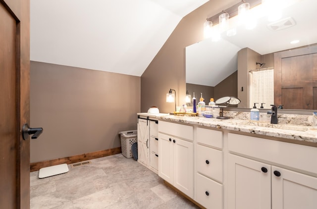 7170 29th Ave SW, Pequot Lakes, MN 56472 - bathroom with vaulted ceiling, double vanity, and a shower with shower curtain