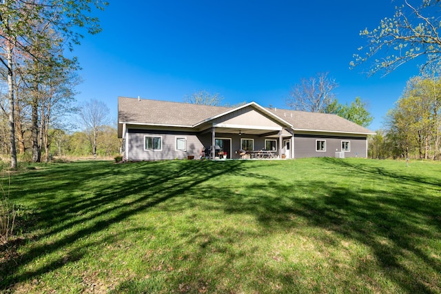 7170 29th Ave SW, Pequot Lakes, MN 56472 - rear view of property with ceiling fan and a yard