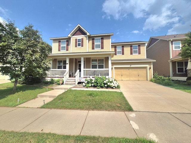 15850 Elmwood Ln, Apple Valley, MN 55124 - view of front of home with a garage, covered porch, driveway, and a front lawn