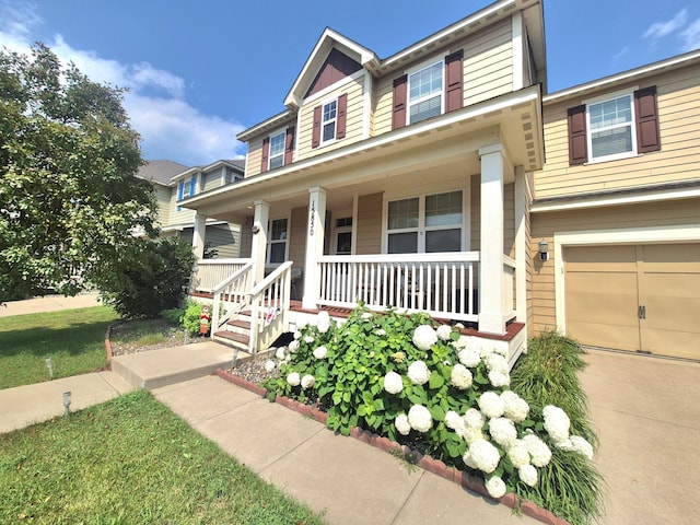 15850 Elmwood Ln, Apple Valley, MN 55124 - view of front of house with covered porch and an attached garage