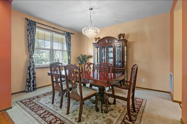 15850 Elmwood Ln, Apple Valley, MN 55124 - dining area with a chandelier and light carpet