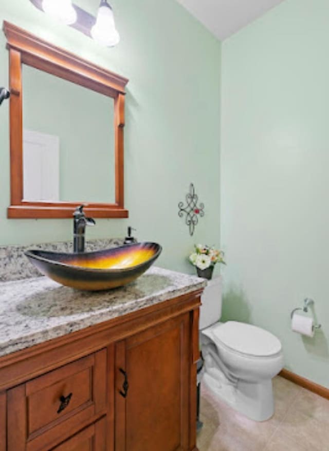 15850 Elmwood Ln, Apple Valley, MN 55124 - half bathroom featuring vanity and tile patterned floors
