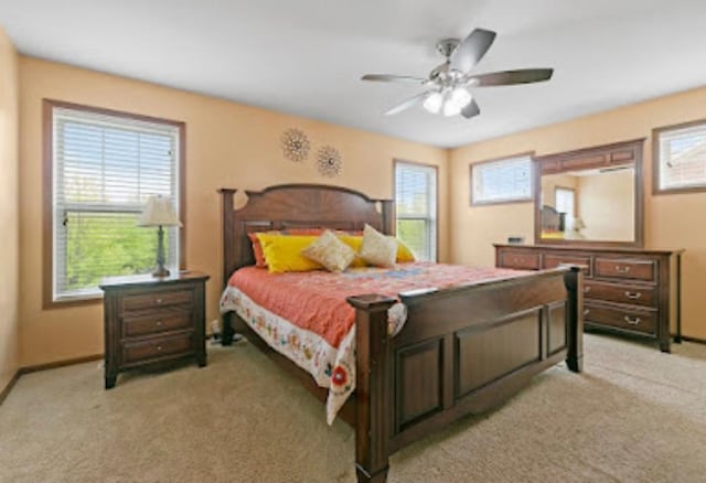 15850 Elmwood Ln, Apple Valley, MN 55124 - bedroom featuring light colored carpet and ceiling fan