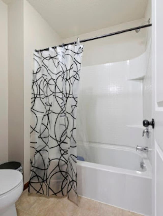 15850 Elmwood Ln, Apple Valley, MN 55124 - bathroom with shower / bath combo and tile patterned floors