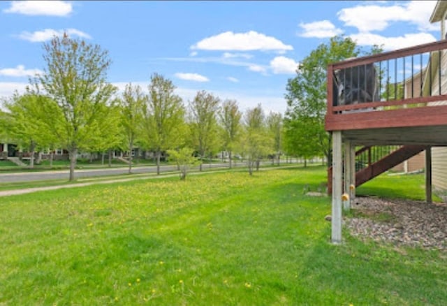 15850 Elmwood Ln, Apple Valley, MN 55124 - view of green lawn with a wooden deck and stairway