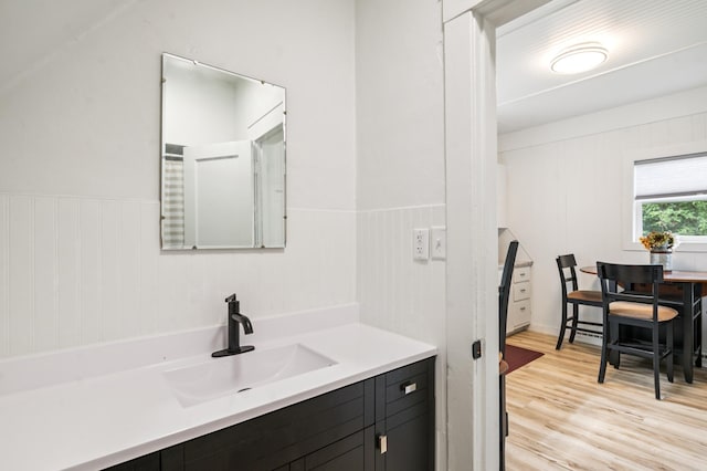 14 15th St, Cloquet, MN 55720 - bathroom with vanity, wainscoting, and wood finished floors
