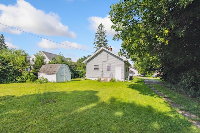 14 15th St, Cloquet, MN 55720 - view of green lawn featuring a storage shed