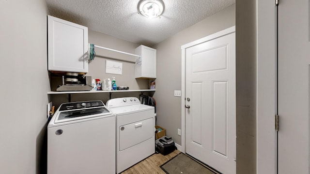 1280 Lone Stone Ct SE, Chatfield, MN 55923 - laundry room with cabinet space, washing machine and clothes dryer, light wood finished floors, and a textured ceiling